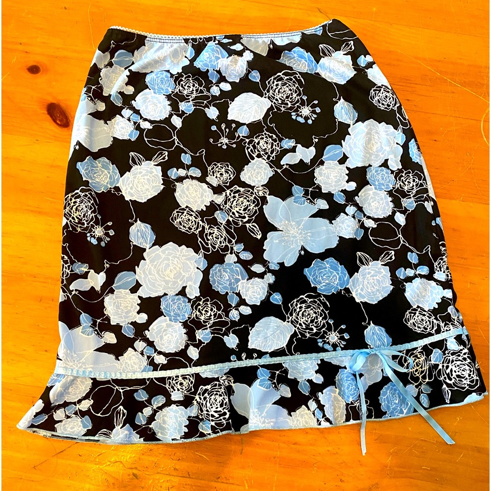 LunaChix y2k above-knee skirt with blue and black floral pattern wavy bottom bow